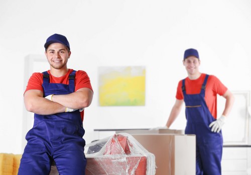 Removal team preparing a Brixton home move with boxes and furniture