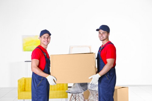 Careful lifting and transport of bulky furniture in Brixton
