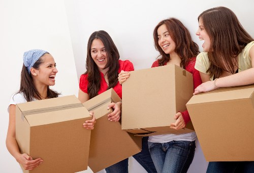 Careful loading of furniture during urgent removals in a Brixton street