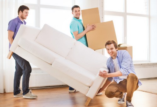 Man and van Brixton service handling furniture and boxes in an urban area