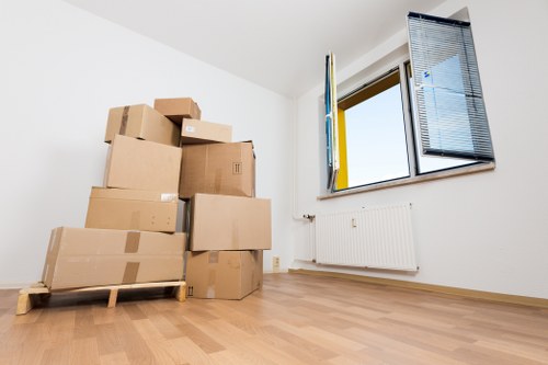 Moving boxes and household items ready for transport in Brixton