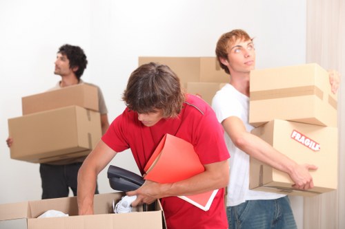 Local removals team handling a flat move in Brixton with tight access