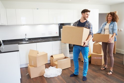 Local team handling sofa and bed pick-up in a Brixton flat