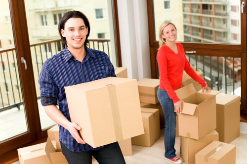 Packed office equipment prepared for moving in Brixton